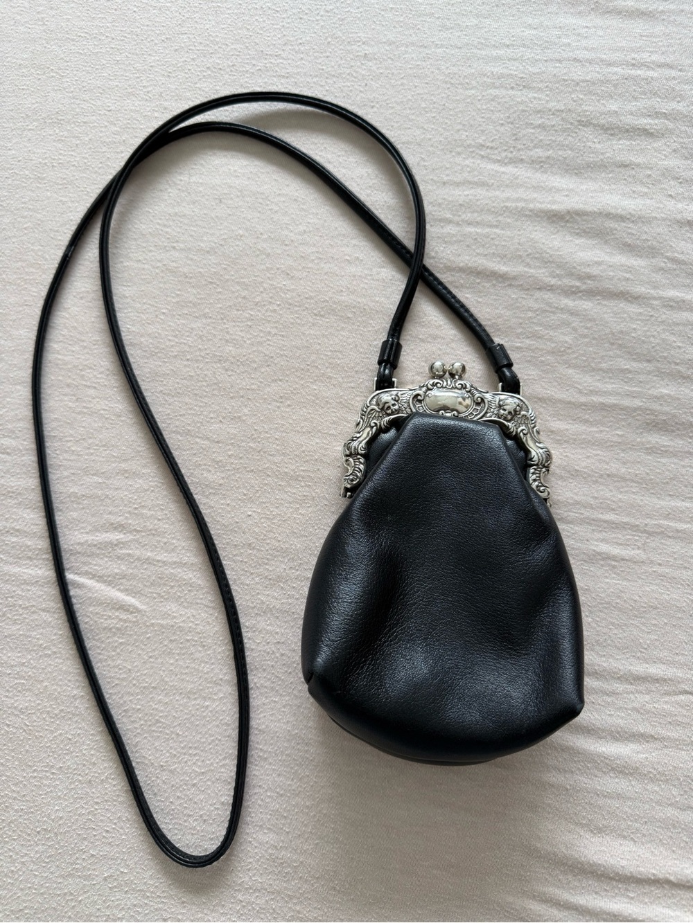 Vintage Black Leather Crossbody Bag with Ornate Silver Frame